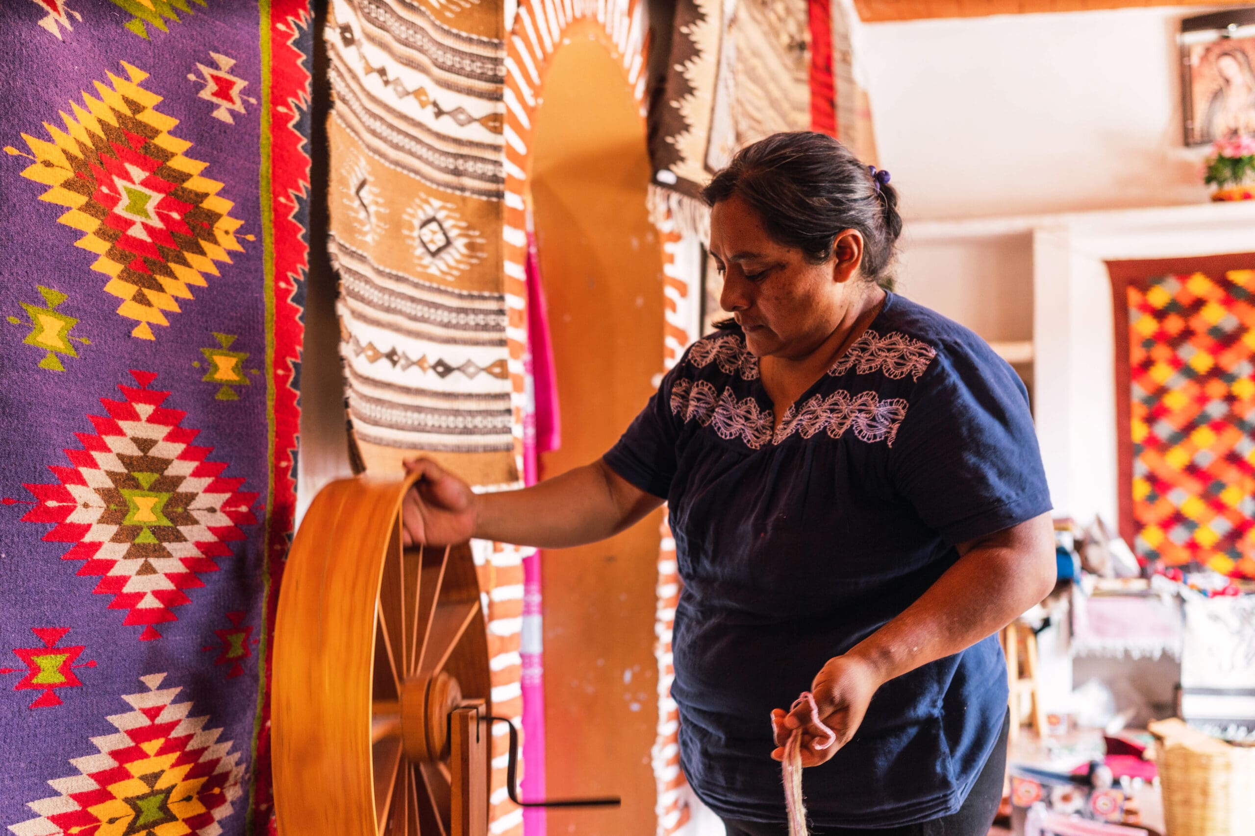 Mayan woman weaving a textile in the region of Oaxaca, Mexico